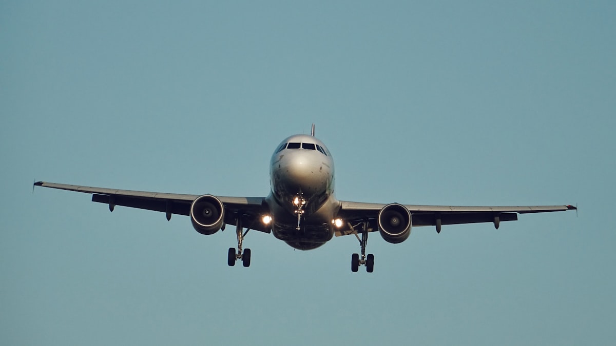 Commercial airplane in flight against a blue sky