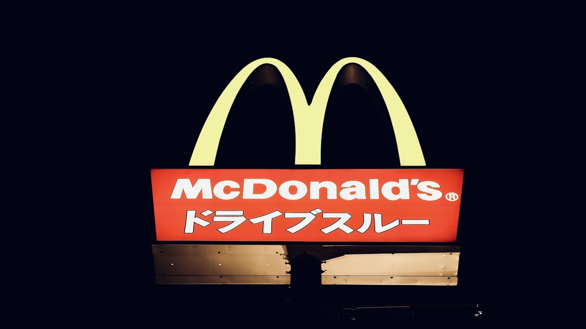 Fast food drive-through lane at night